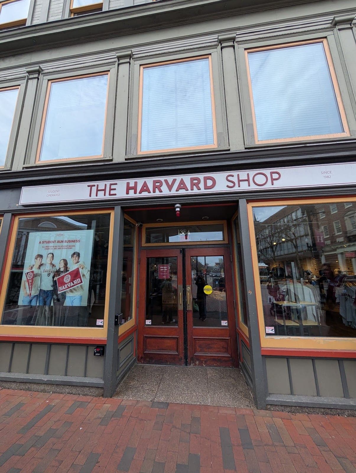 The front of The Harvard Shop, with its red sign and wooden doors.