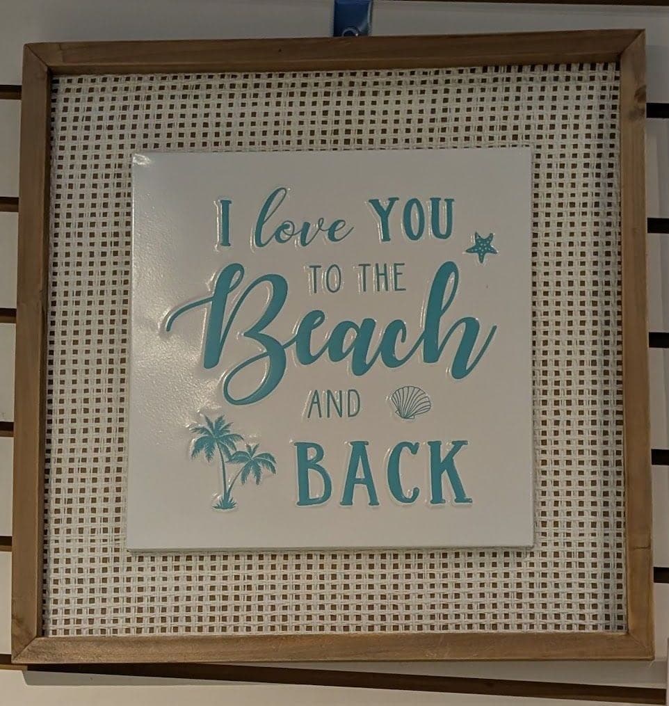A framed sign that reads "I love you to the beach and back".